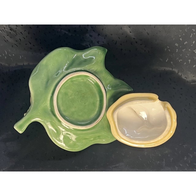 Add a cheerful touch of Portuguese artistry to your table with this charming Bordallo Pinheiro lemon-shaped jam pot....