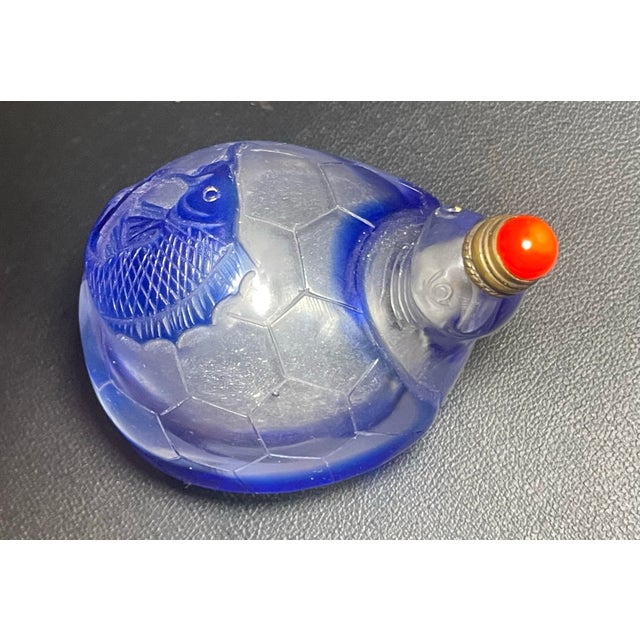 Antique early Republic Period cameo overlay cobalt blue glass snuff bottle. The rounded body is shaped as a tortoise...