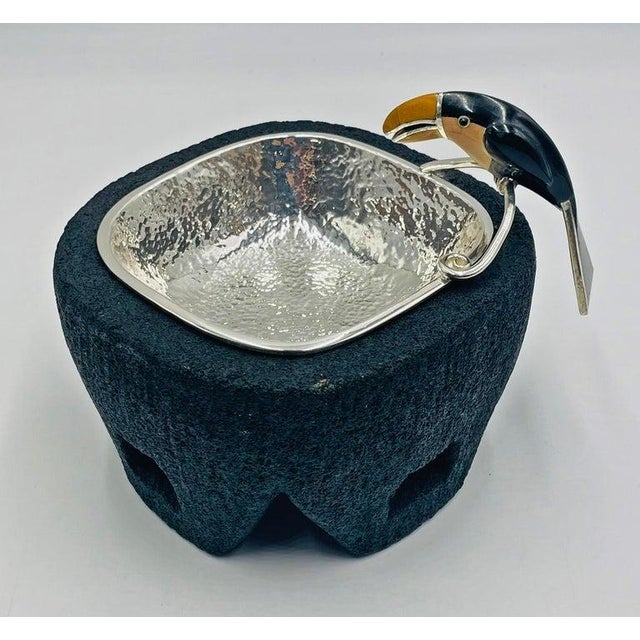 A whimsical and collectible silver-plated bowl with volcanic-rock base designed and manufactured in the 1980s by renowned...