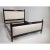 Modern Queen size bed frame. The frame is done in an ebony finish. The upholstered insets are a cream, beige chenille. The...
