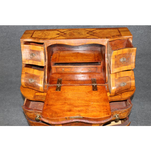 Italian Rococo-Style Olive Wood Secretary Desk, Late 19th/Early 20th Century A remarkably decorative Italian olive wood...