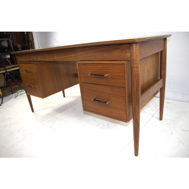 Ramseur Mid Century Modern Walnut Desk. This beautiful and rare illustrates a delightful fusion of vintage charm and...