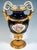 Double snake-handled vase in baluster form on mounted funnel-shaped base, handles raised at the sides in the form of...
