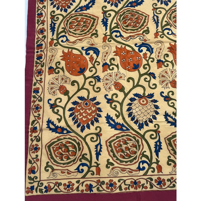 A striking vintage textile featuring an intricate pomegranate and floral vine motif, inspired by traditional Indian and...