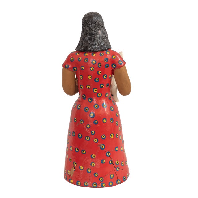 A charming and expressive example of Brazilian arte popular, this hand-painted clay sculpture captures the heart and soul...