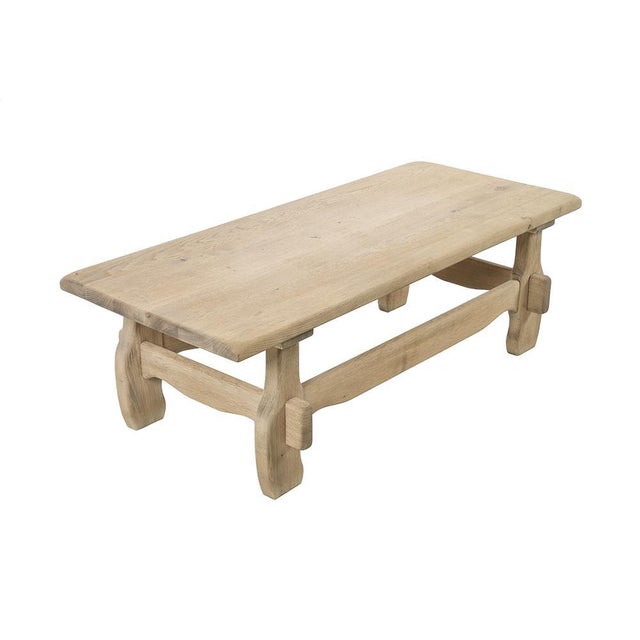 Oak coffee table that has been sanded This piece is designed in the style of the selected designer and/or manufacturer