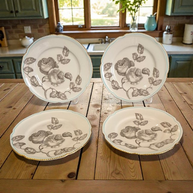 This product is a set of four vintage Castleton Gloria dessert plates, featuring a beautiful design of taupe roses with a...