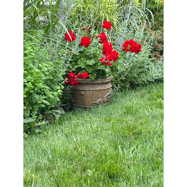 Cast stone Neoclassical garden planter from the 1990s, featuring an elegant flared shape that is wider at the top,...