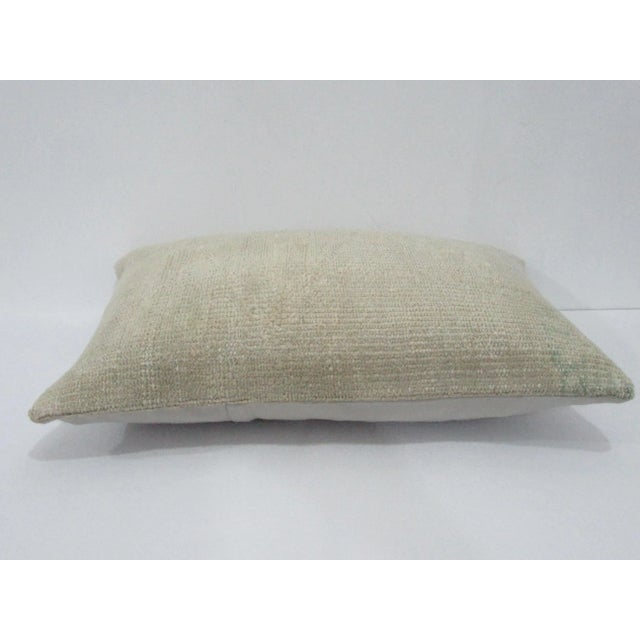 Decorative pillow cover made from a vintage Turkish handknotted rug. Backed with good quality cotton fabric. Pillow...