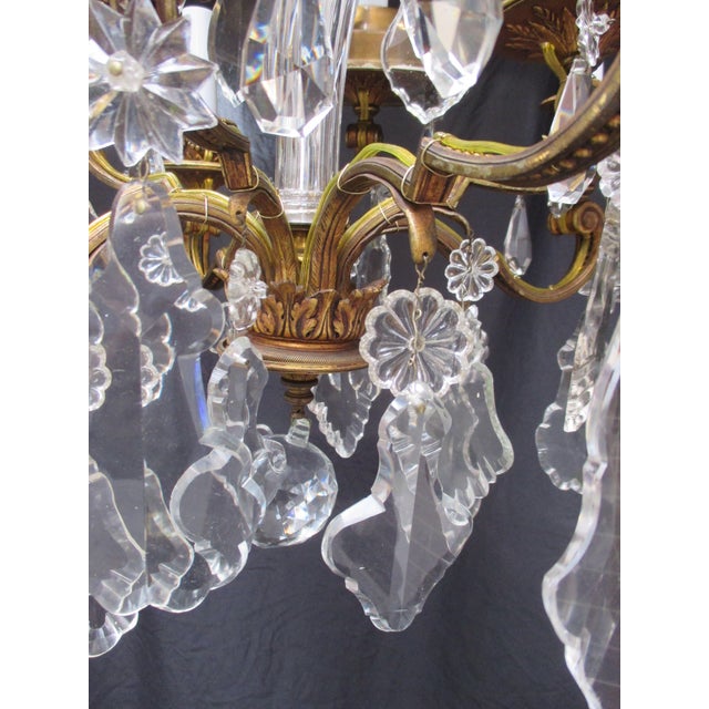 Beautiful gilt bronze armature with cut crystal. Eight chandelier sockets with surface wiring , ( new wiring, new sockets...