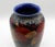 Circa 1930 large vase "Pomegranate" design by Moorcroft, England. Designed by William Moorcroft, the body festooned with...