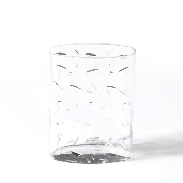 This Mid-Century Modernist cut crystal vase, signed by the esteemed American luxury brand Tiffany & Co., represents...