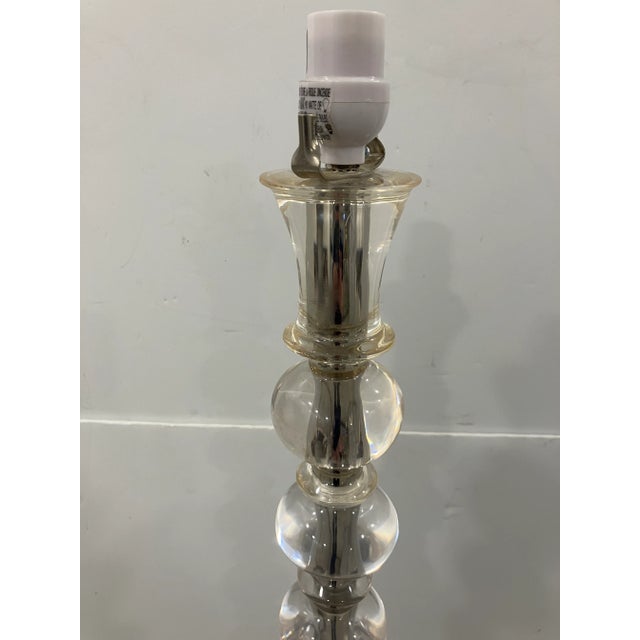 This Deco style floor lamp has a floor switch. This lamp is all lucite- spheres, connectors and base