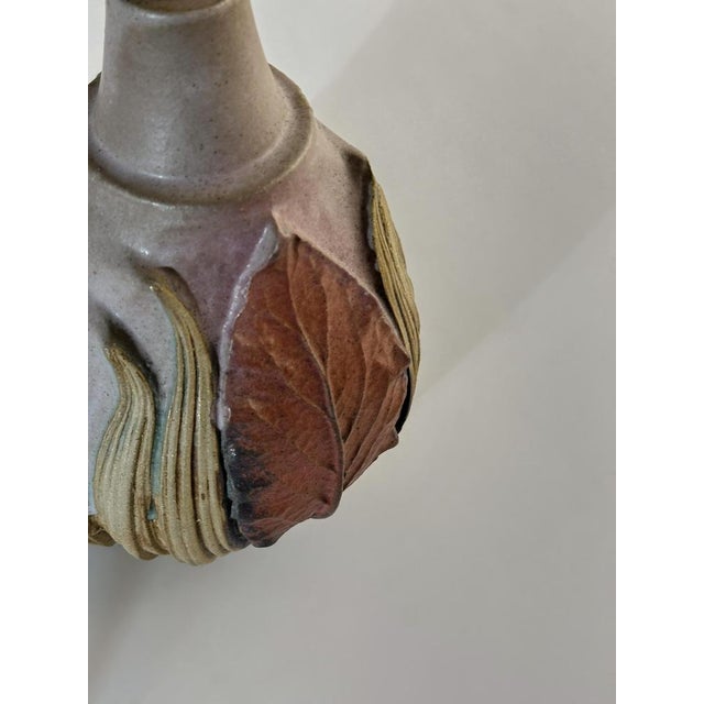 An uncommon and quietly expressive example of bernard rooke’s studio pottery, this handcrafted ceramic table lamp dates to...