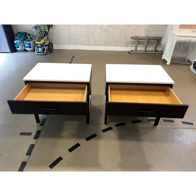 These custom nightstands combine rich oak stained in espresso with the cool, organic elegance of limestone. The honed...