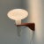 Artimeta wall lamp from the 1960s, made of teak and white glass. The condition is still very good with miniml traces of...