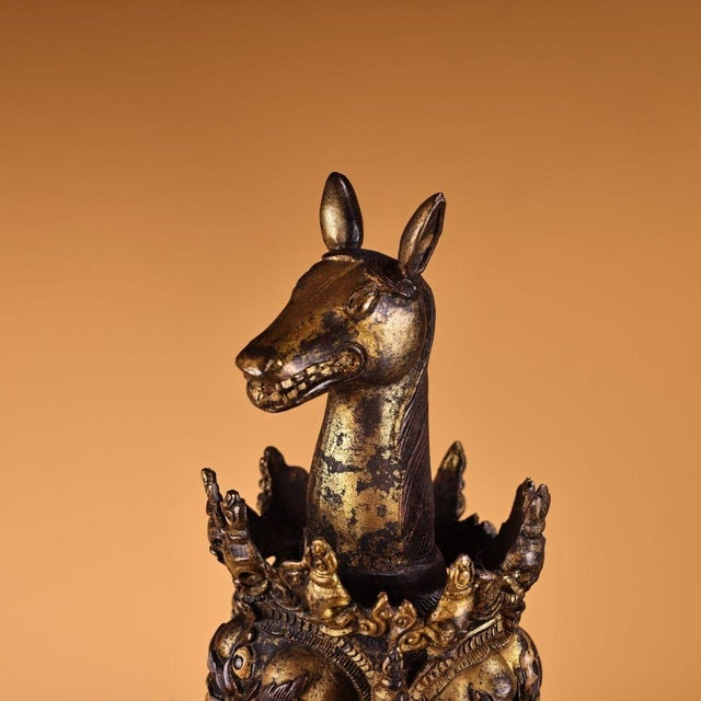 An impressive large-scale Tibetan Buddhist ritual phurba (vajra dagger), finely cast in solid bronze with partial gilded...