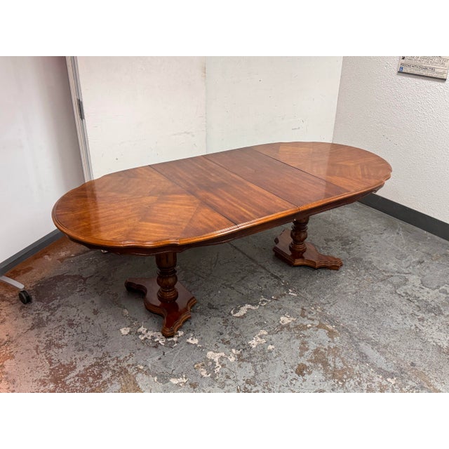Design Plus Gallery presents an Extension Dining Room Table. This vintage dining table is supported by a double pedestal...