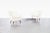 Mid-century modern lounge chairs designed by Austrian designer Ernst Schwadron in the 1940s, showcasing the graceful...