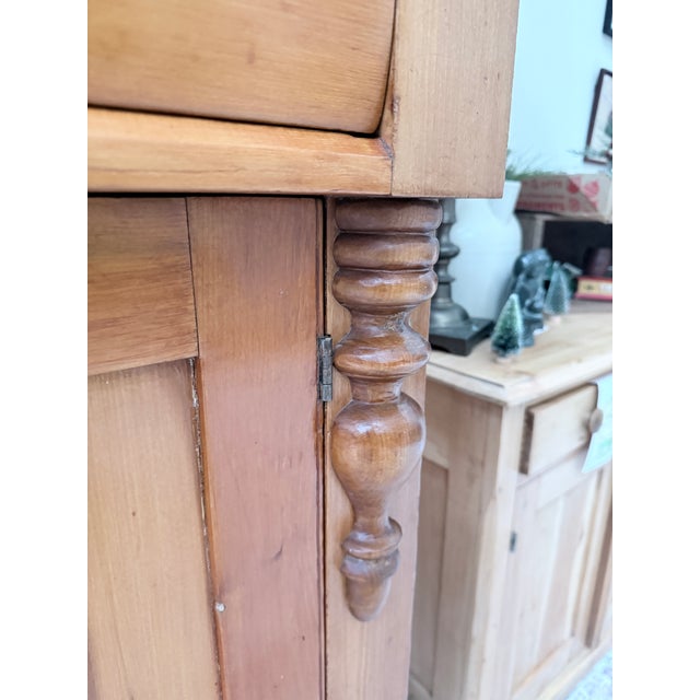 This early Pennsylvania pine jelly cabinet is a wonderful example of regional country furniture, blending utility with...