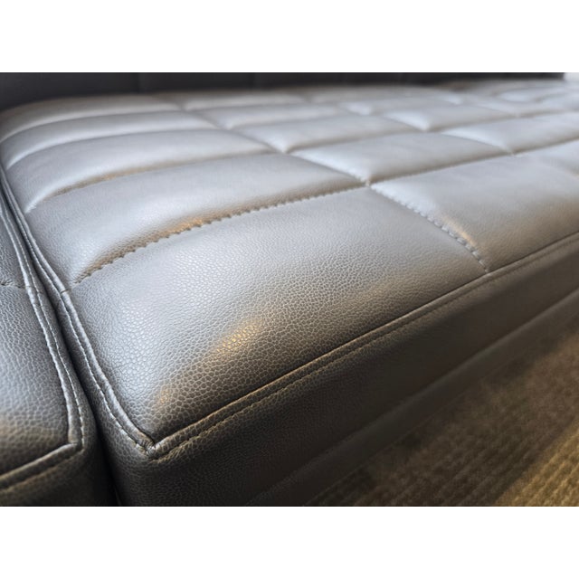 The Geiger Tuxedo Settee is a refined, architectural seating piece that blends modern minimalism with exceptional...