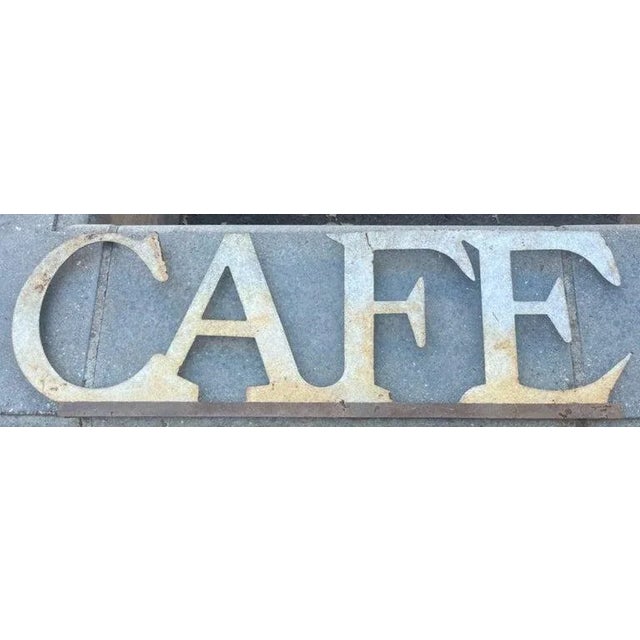 E20thc Cafe Sign on a custom stand. Great patina that shows wear consistent with age and use. The custom stand is a sturdy...
