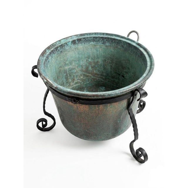 This striking rustic planter features a large, hand-hammered copper basin with a deep, rounded profile and a wide rim. The...