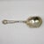 An exquisite turn-of-the-century sterling silver serving spoon in the highly coveted "Carnation" pattern by the Watson...