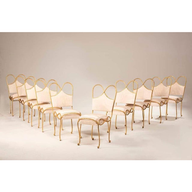 Elegant Set of 10 French Wrought Iron Chairs, 1940s Refined set of 10 French wrought iron chairs dating back to the 1940s....