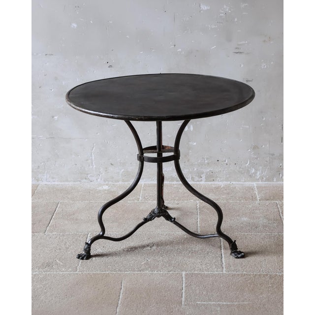 French Arras bistro table in cast and wrought iron, dating from the second half of the 19th century. The round metal top...