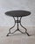 French Arras bistro table in cast and wrought iron, dating from the second half of the 19th century. The round metal top...
