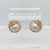 A very fine pair of Mabe Pearl clip earrings. By Gubelin (or Guebelin). With 18k gold stylized sea shell mounts and set...