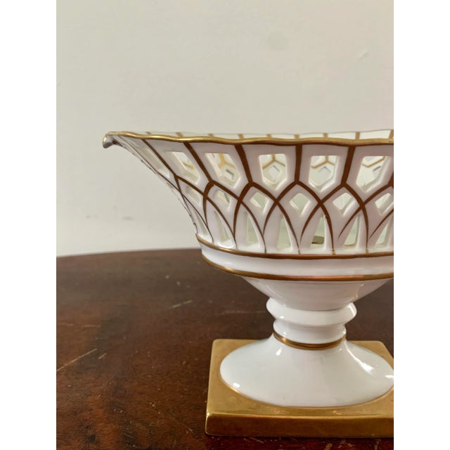 A gorgeous white & gold regency style reticulated porcelain basket compote Circa late 20th century Measures: 7.88"W x...