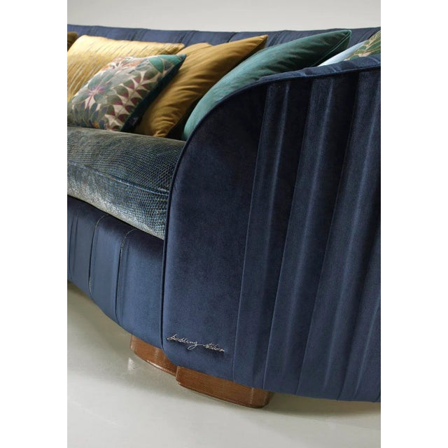 Ritz sofa with solid wood frame. Upholstery and seat in polyurethane. Deco feather cushions. Upholstery in joined and...