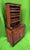 This 18th-century French Country Vaisselier is a charming antique collectible crafted from rich wood that has developed a...