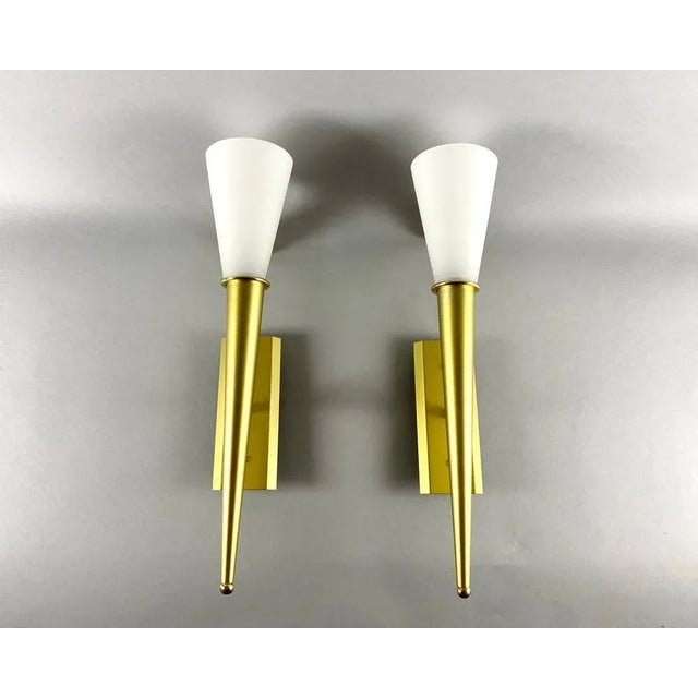 Elegant white glass pair of wall lights in conical shape with gold brushed metallic frame by wofi leuchten, germany. a...