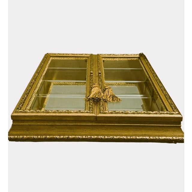 "Made in Italy" Gold Leaf Mirrored Wall Curio Cabinet by Creazioni Artistiche. Elevate your space with this stunning...