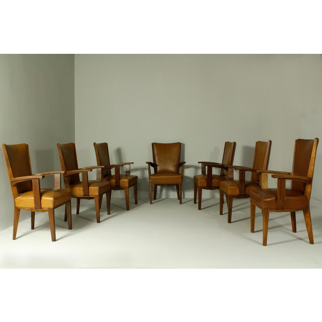 Set of 7 oak chairs marked by H.Pander from the 1920s. Later professionally reupholstered in faux leather. The chairs are...