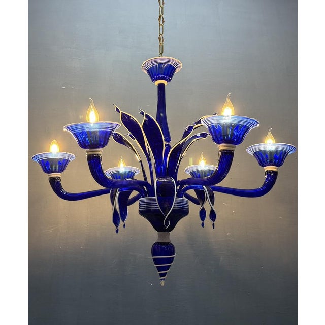 Elevate your interior with this striking vintage Murano glass chandelier, a masterclass in Italian craftsmanship from the...