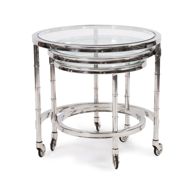 Everything is better in 3's! This polished stainless steel frame telescopes out to reveal 3 tables with tempered glass...