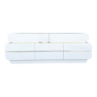 Postmodern Galactic White Gloss Laminate Waterfall Dresser With Gold Accents For Sale