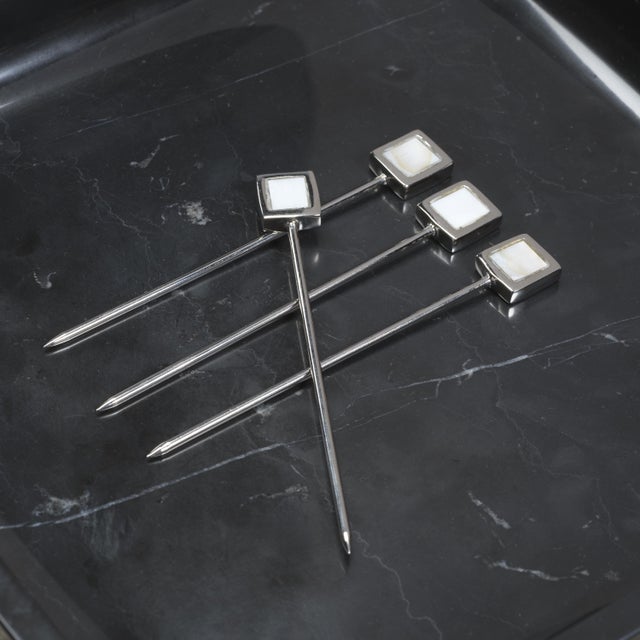 A sophisticated addition to any barware collection, this set of four cocktail picks is crafted from polished brass and...