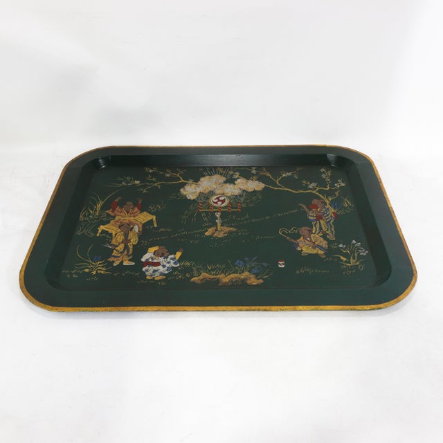 This elegant vintage rectangular tray features a deep, dark green lacquer finish and a refined gold-painted rim that...