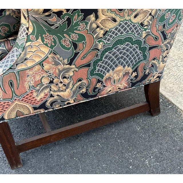 Handsome well proportion Chippendale style Camel back loveseat with molded legs and a stretcher base. Loveseat has a down...