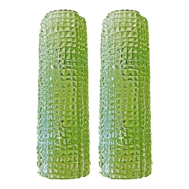 Luxury and scenoghraphic wall sconces in Murano glass, with a crocodrile texture of glass that make it sparkling even when...
