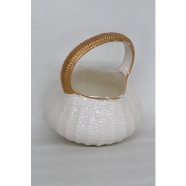 This beautiful basket sculpture is made of porcelain; it is stamped as being made by Royal Worcester in 1884, see...