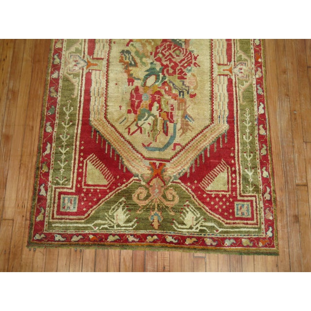 A full pile vibrant colored Turkish Ghiordes rug from the early stages of the 20th century. 3'11'' x 6'