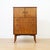 This elegant British mid-century gentleman's chest offers a refined blend of style and practicality. Crafted in...