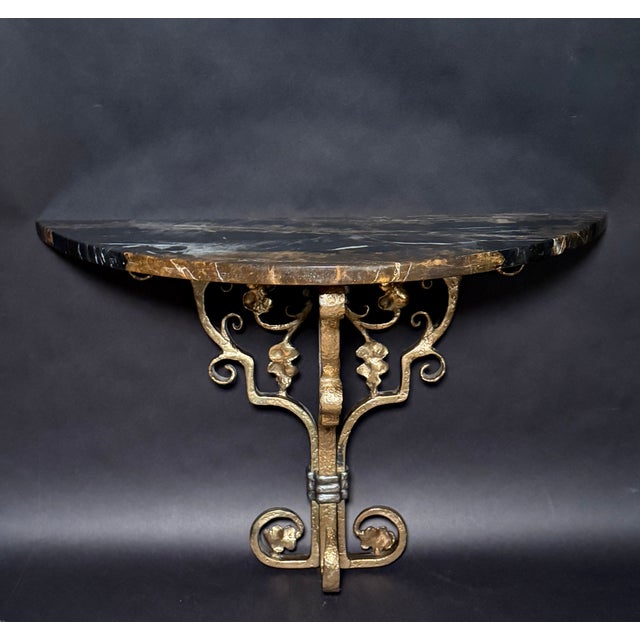 This striking pair of wall-mounted brackets exemplifies the strength, craftsmanship, and material honesty associated with...