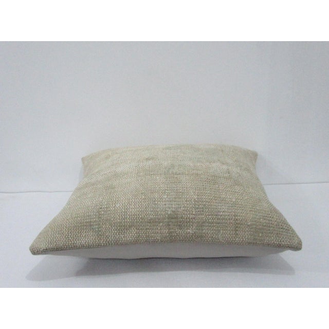 Decorative pillow cover made from a vintage Turkish handknotted rug. Backed with good quality cotton fabric. Pillow...